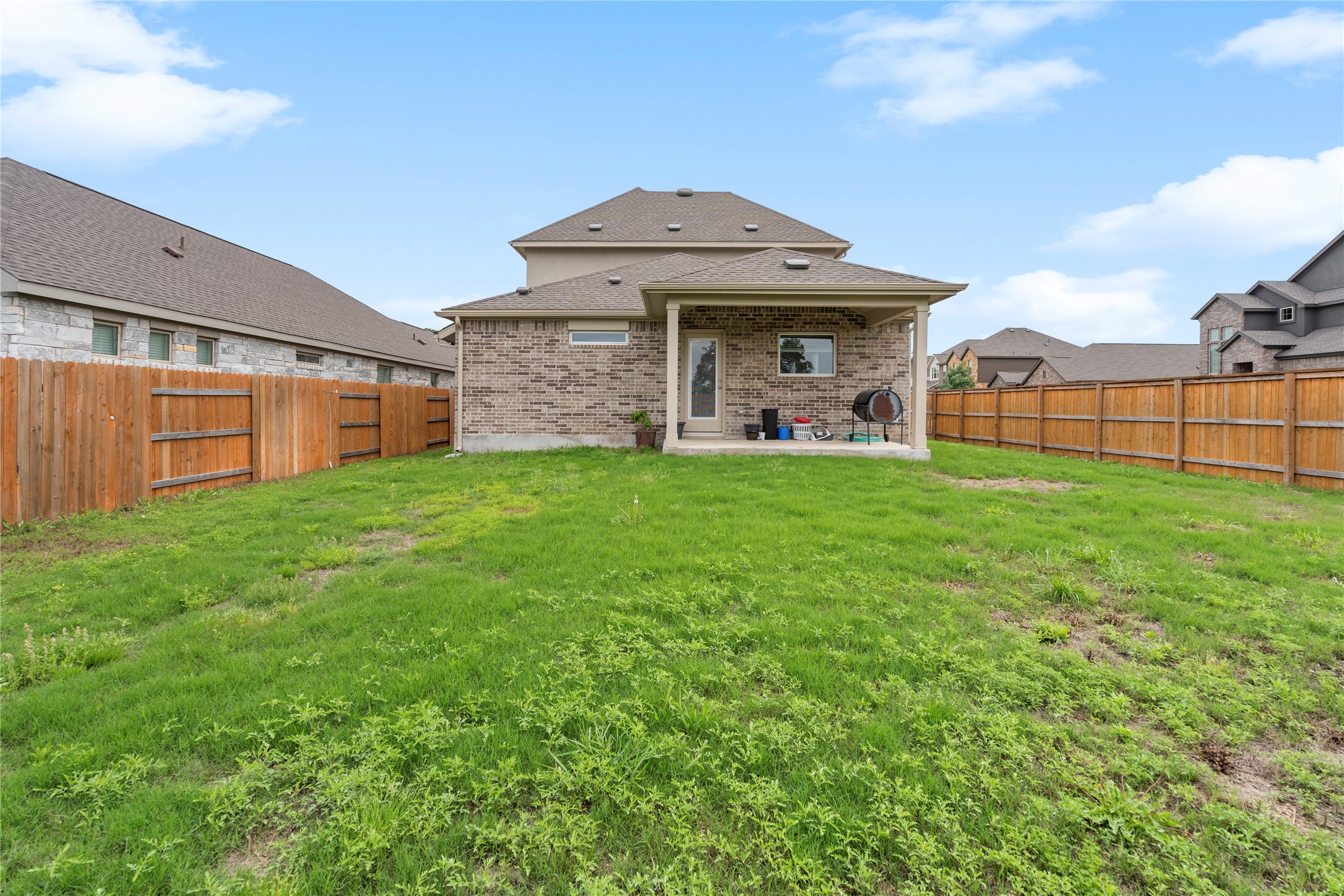 660 Pheasant Hill Lane Georgetown, TX 78628 - Photo 33 of 38 a view of a house with a yard and sitting area