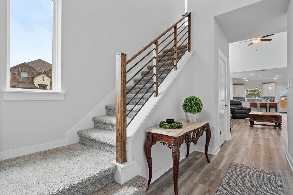 660 Pheasant Hill Lane Georgetown, TX 78628 - Photo 5 of 38 a view of dining room and livingroom with furniture wooden floor and a rug