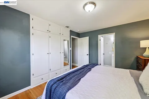 a bathroom with a sink a mirror and a shower curtain