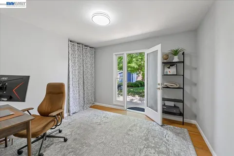 a bed room with two beds and a window