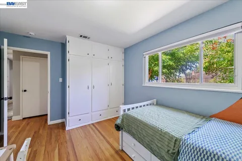 a bathroom with a sink a toilet and shower curtain