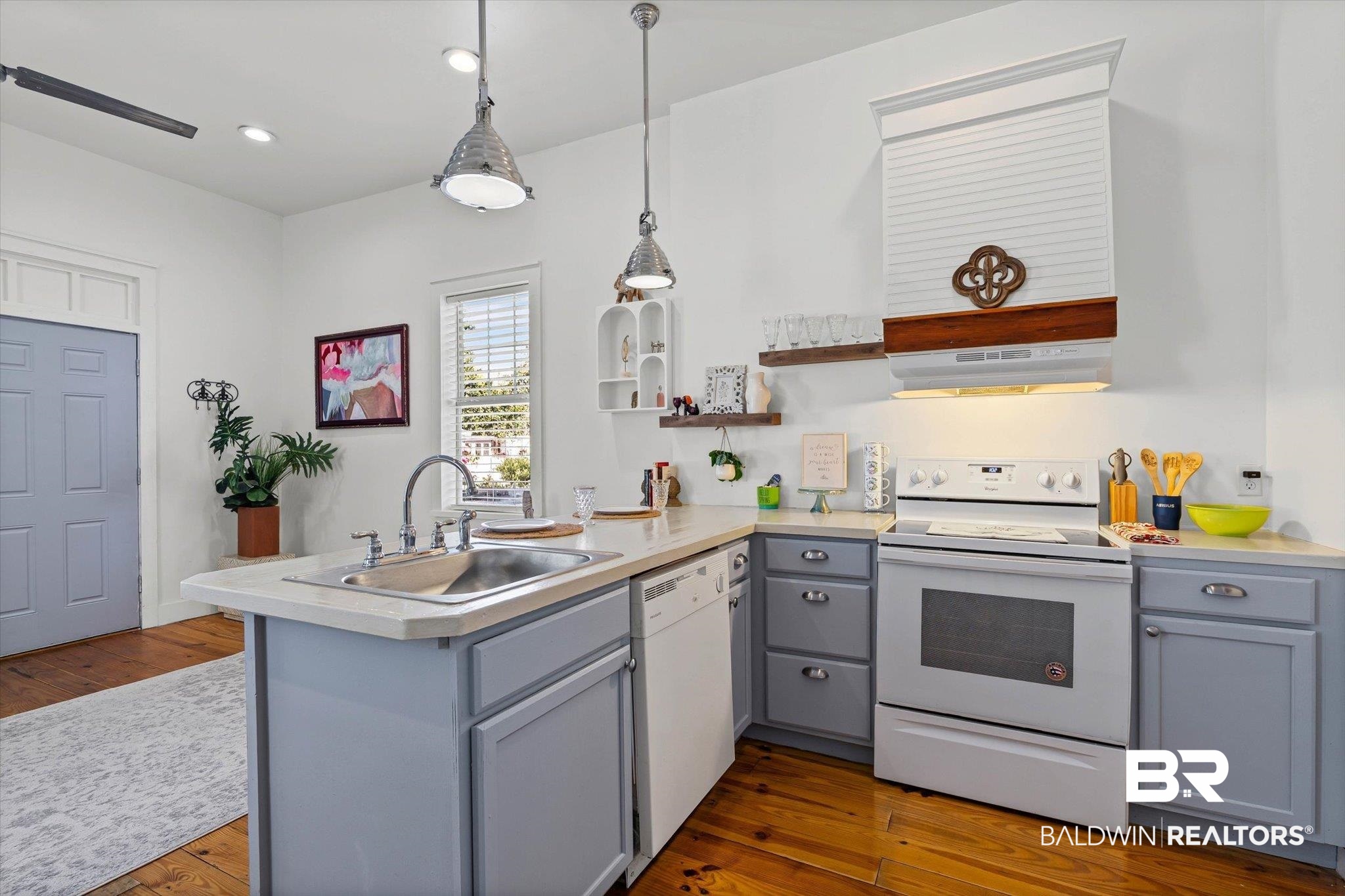 951 Montgomery Street Mobile, AL 36604 - Photo 7 of 22 Kitchen featuring wood-finish flooring, light grey cabinetry, and a built-in dishwasher
