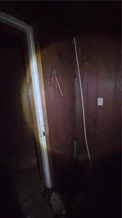 a view of a backyard of the house and car parked