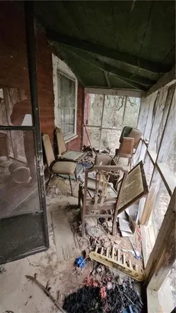 a view of backyard with outdoor seating