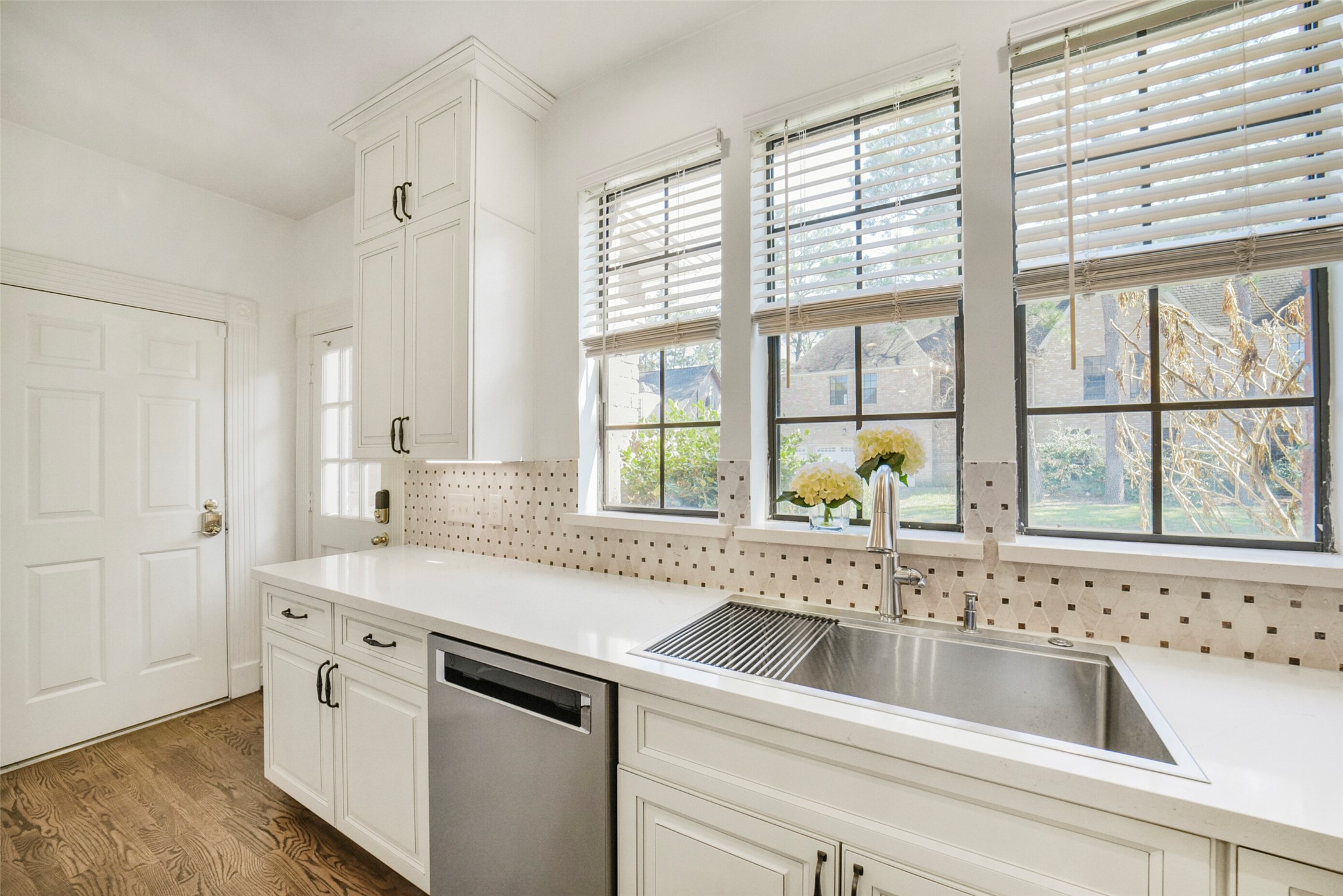 17302 Atherington Place Spring, TX 77379 - Photo 19 of 50 Windows above the kitchen sink have a beautiful view to the side yard.