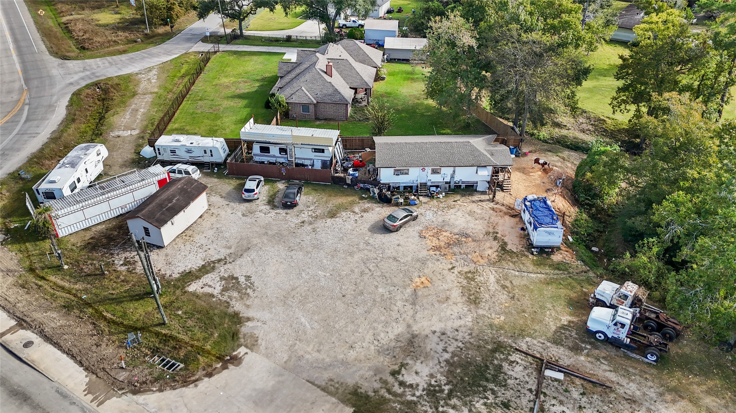 13314 Crosby Lynchburg Road Crosby, TX 77532 - Photo 12 of 13 a aerial view of a house with a yard and sitting area