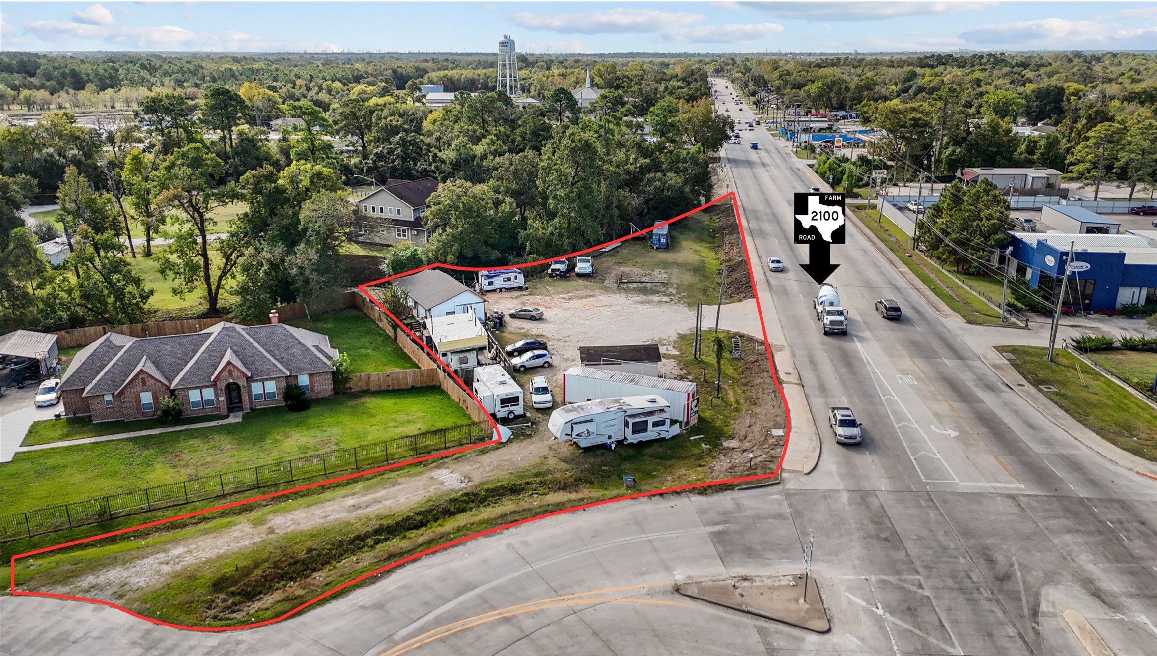13314 Crosby Lynchburg Road Crosby, TX 77532 - Photo 2 of 9 an aerial view of a house with a garden and lake view