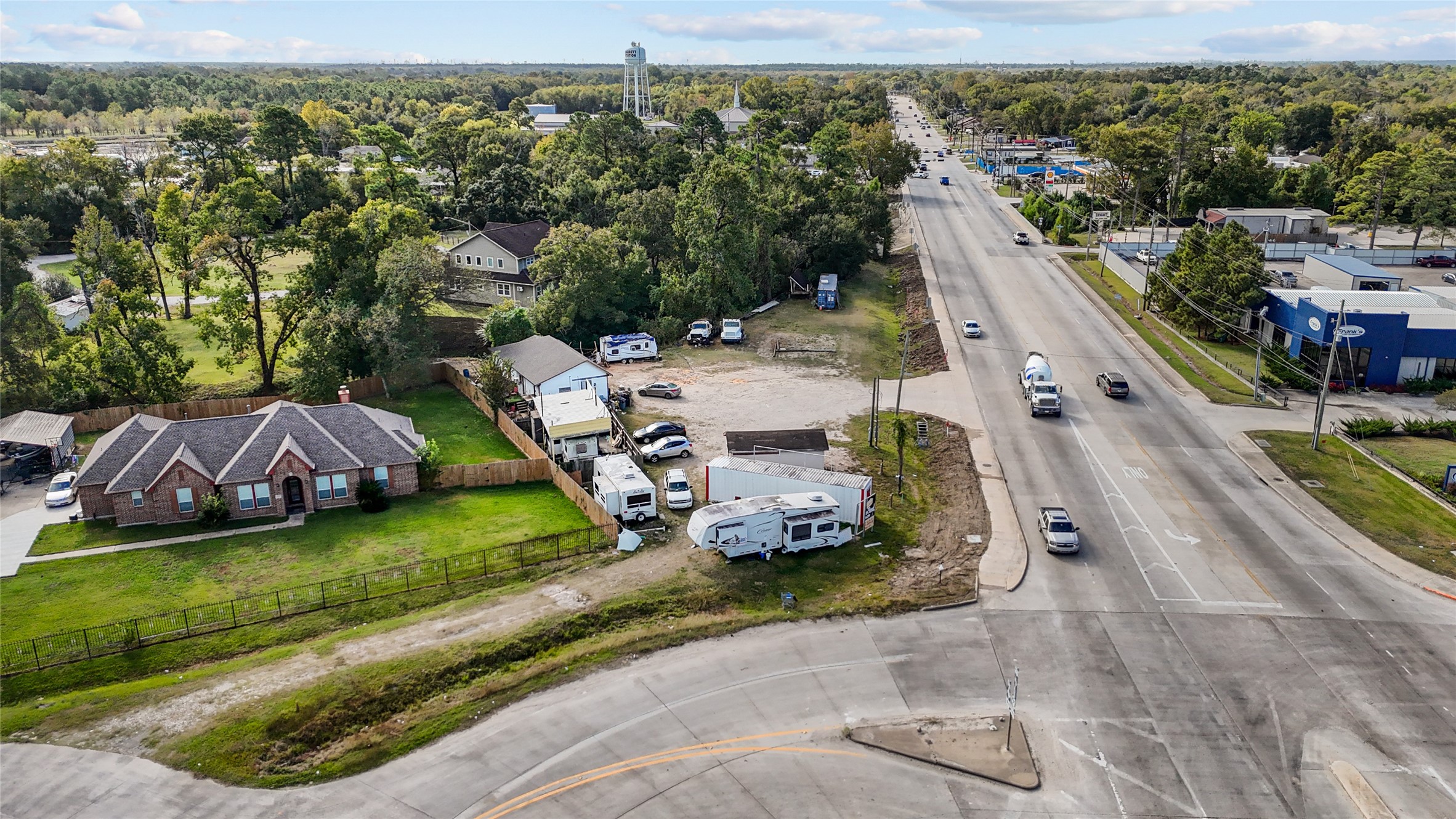 13314 Crosby Lynchburg Road Crosby, TX 77532 - Photo 7 of 9 an aerial view of a house with a garden and lake view