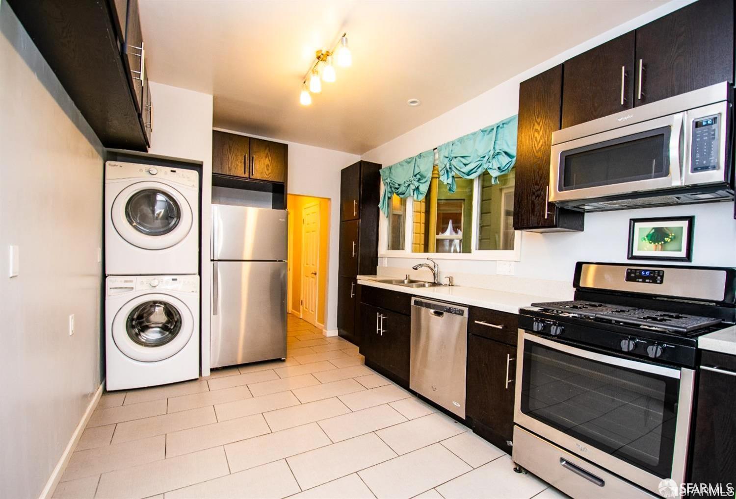 a kitchen with a stove and a microwave