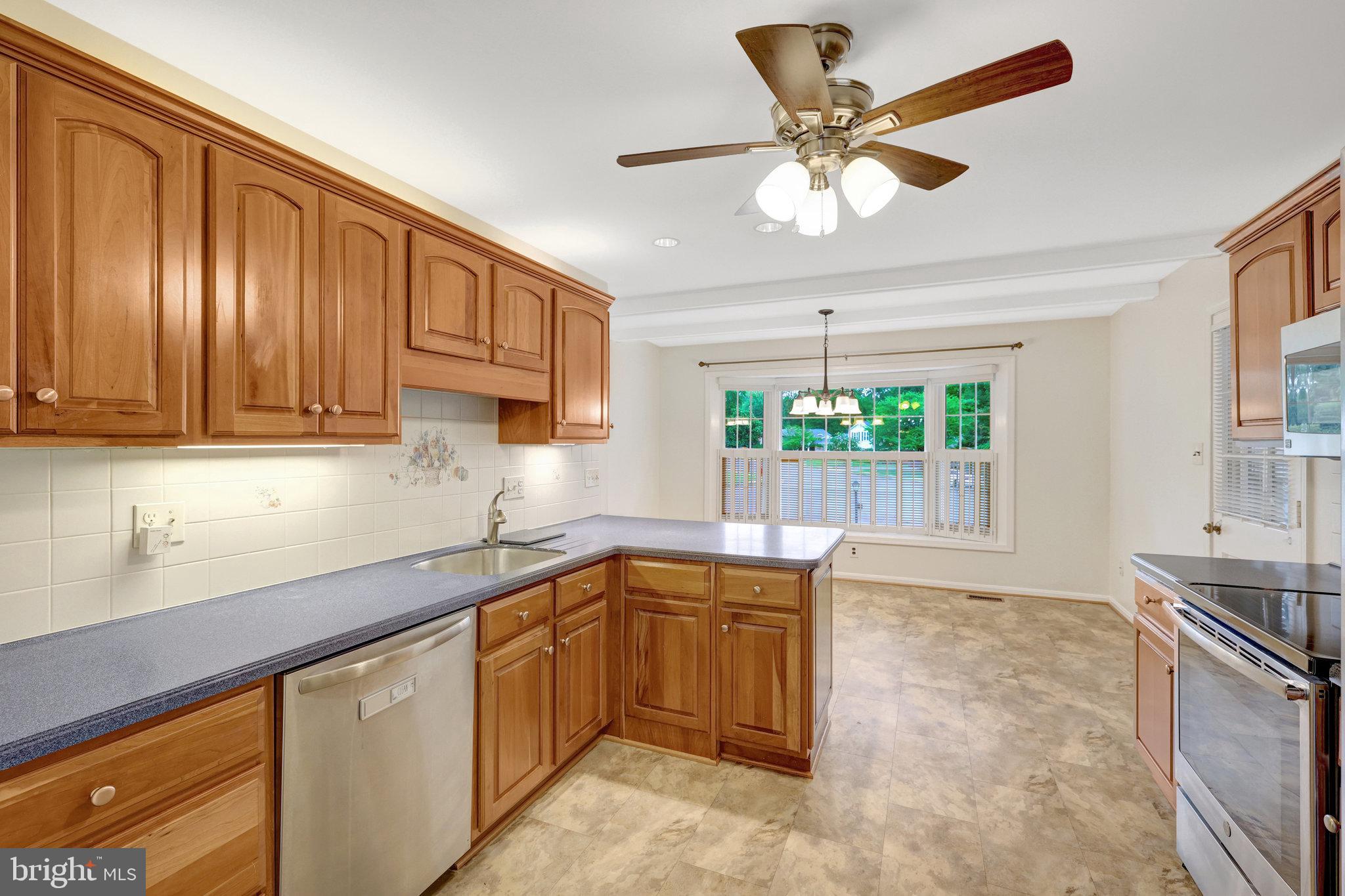 615 Kearney Court Southwest Vienna, VA 22180 - Photo 11 of 53 a kitchen with a sink window and cabinets