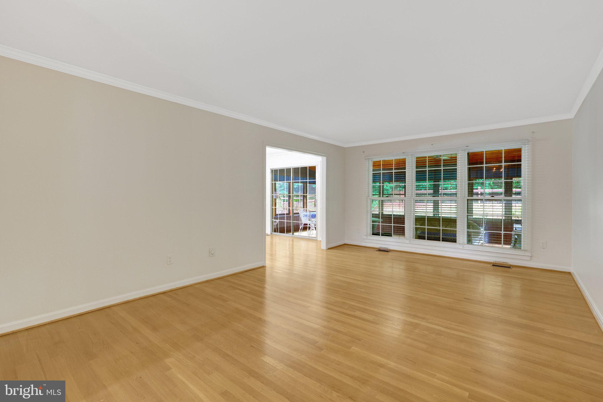 615 Kearney Court Southwest Vienna, VA 22180 - Photo 15 of 53 wooden floor in an empty room with a window