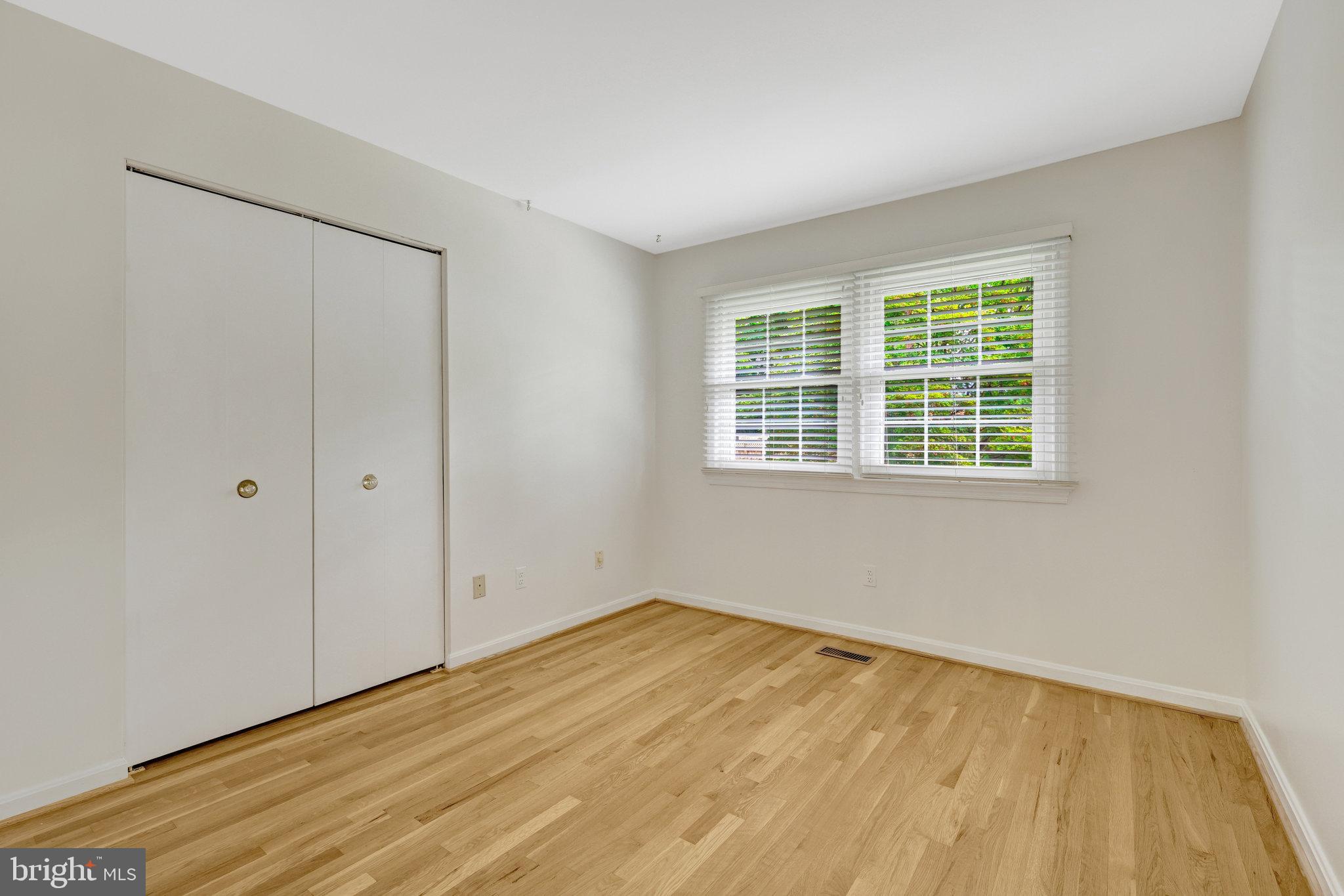 615 Kearney Court Southwest Vienna, VA 22180 - Photo 26 of 53 a view of empty room with wooden floor and fan