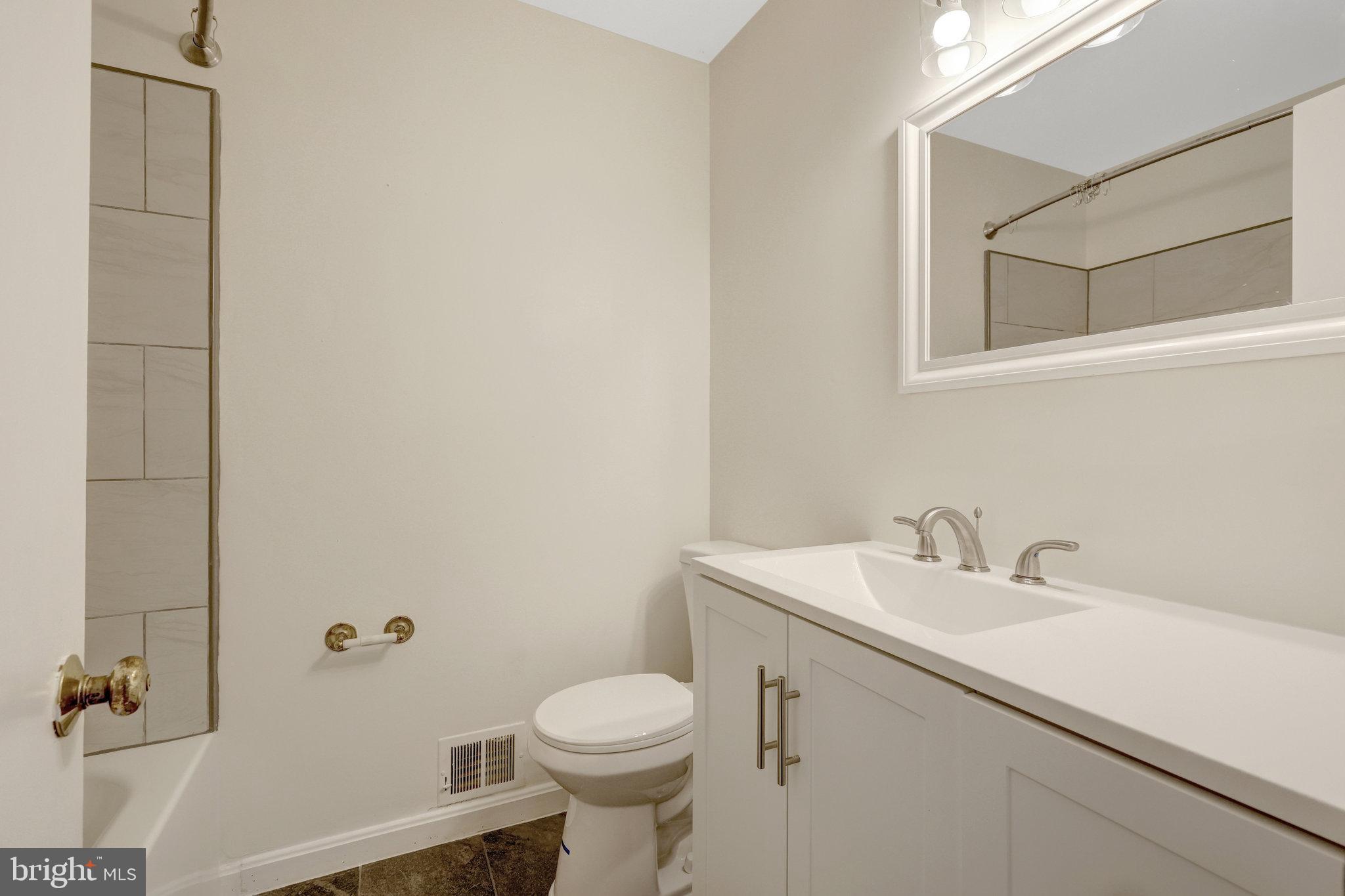 615 Kearney Court Southwest Vienna, VA 22180 - Photo 28 of 53 a bathroom with a sink toilet and vanity