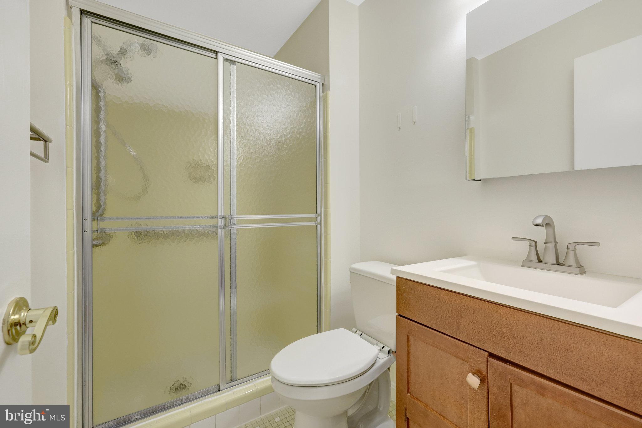 615 Kearney Court Southwest Vienna, VA 22180 - Photo 31 of 53 a bathroom with a granite countertop sink toilet and shower