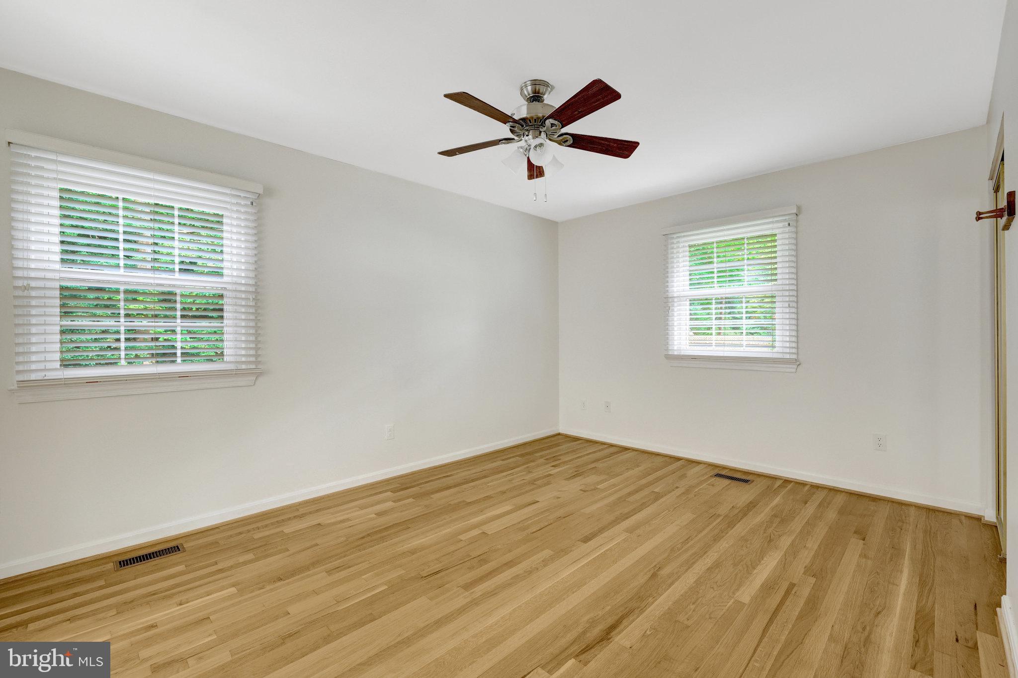 615 Kearney Court Southwest Vienna, VA 22180 - Photo 32 of 53 a view of empty room with wooden floor and fan