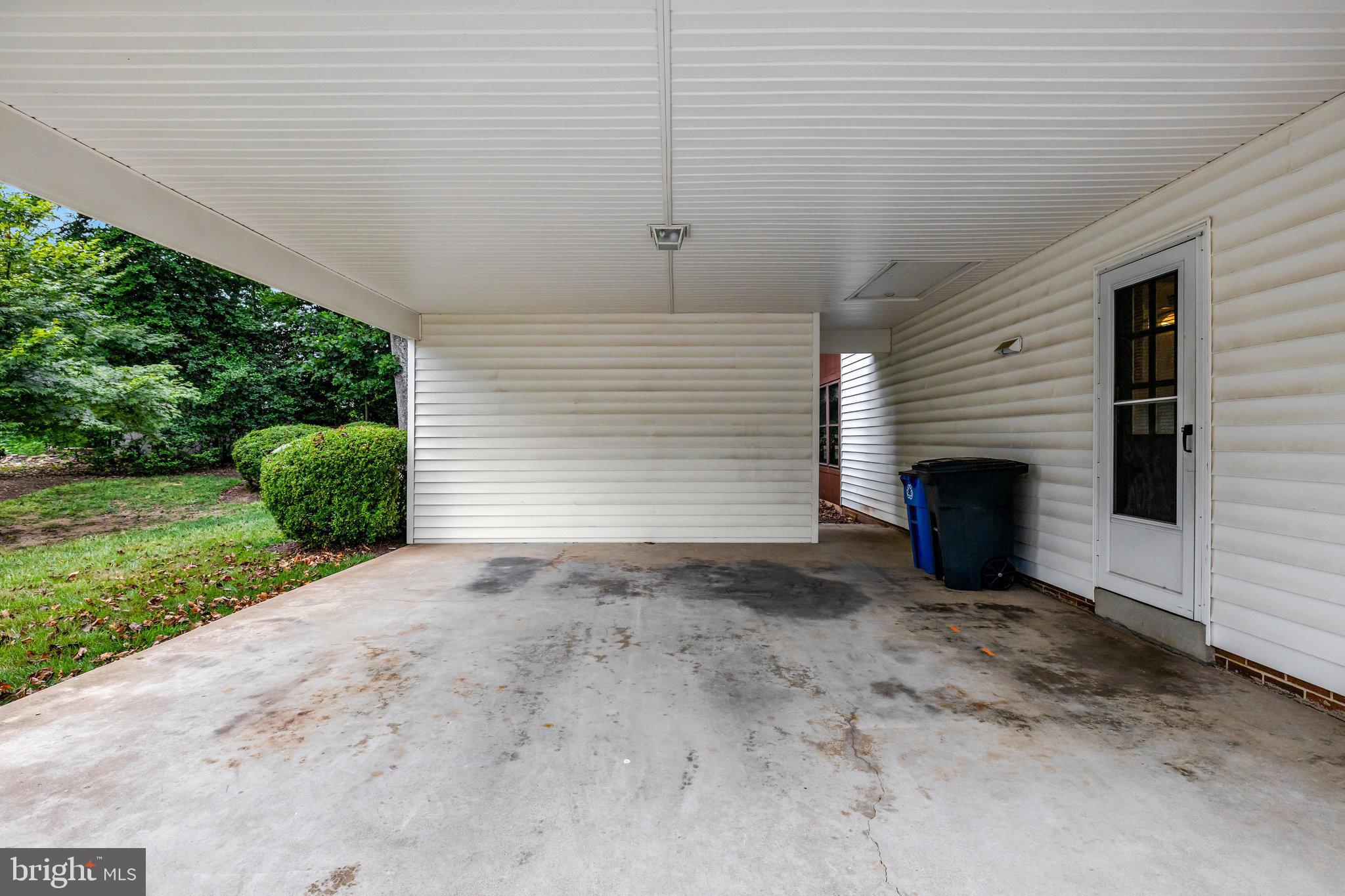 615 Kearney Court Southwest Vienna, VA 22180 - Photo 44 of 53 a view of a house with a yard and garage