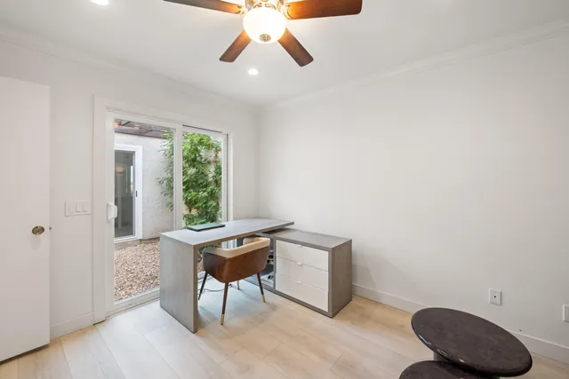 a workspace with furniture and a window