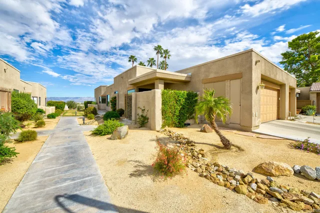 a view of a backyard of the house