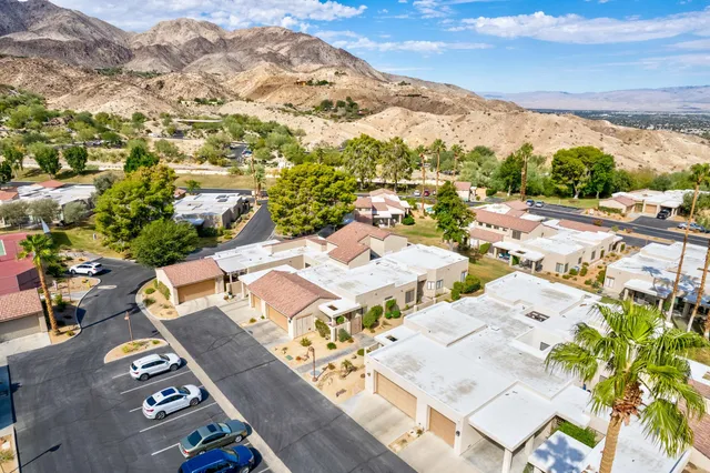 an aerial view of a residential houses with outdoor space
