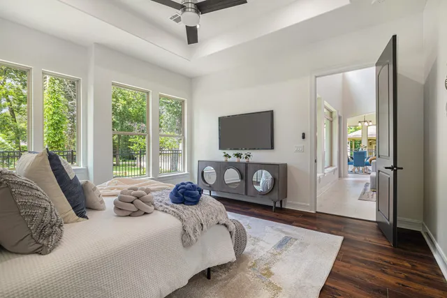 a bedroom with a bed and a television