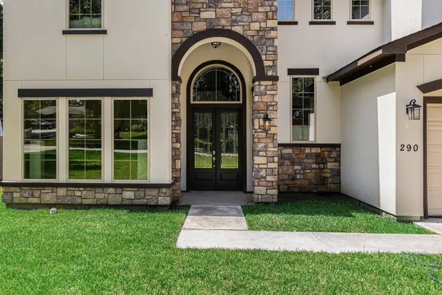 a view of a house with a small yard
