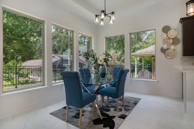 a view of a dining room with furniture window and outside view