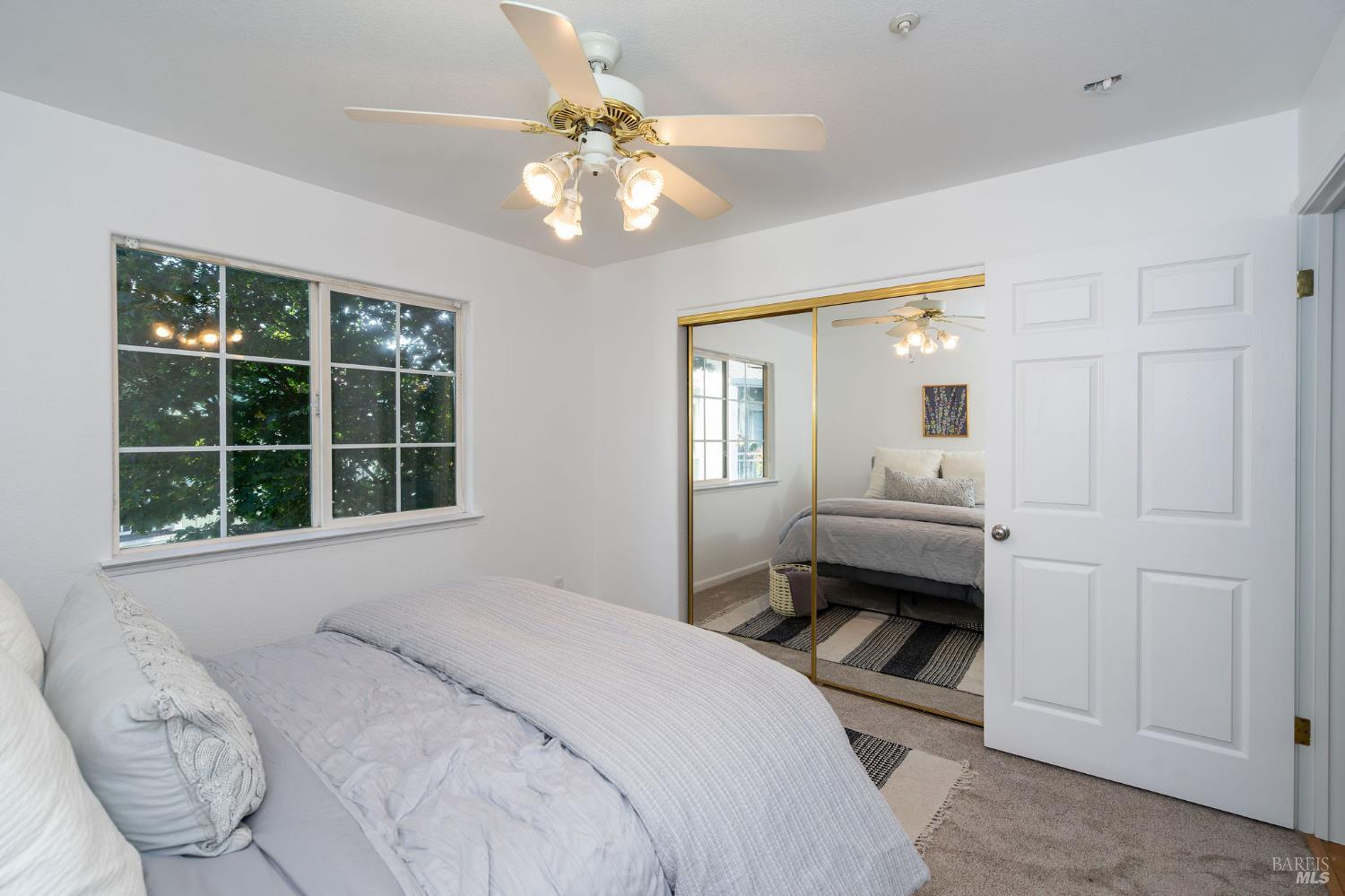 1501 La Esplanada Place, Unit 326 Santa Rosa, CA 95404 - Photo 8 of 10 a bedroom with a bed and a window