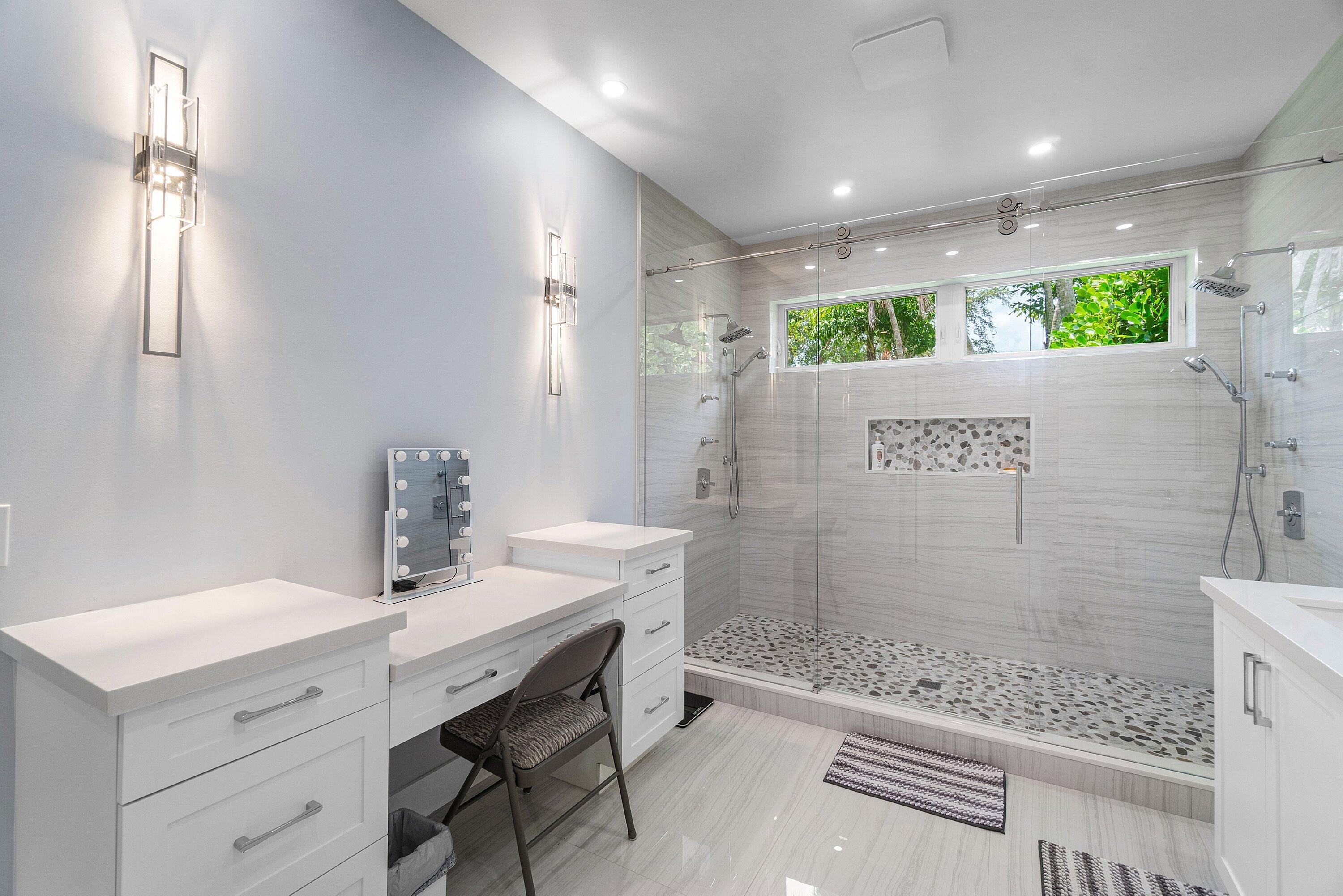 2404 Northwest 67th Street Boca Raton, FL 33496 - Photo 23 of 74 a bathroom with a sink and a mirror