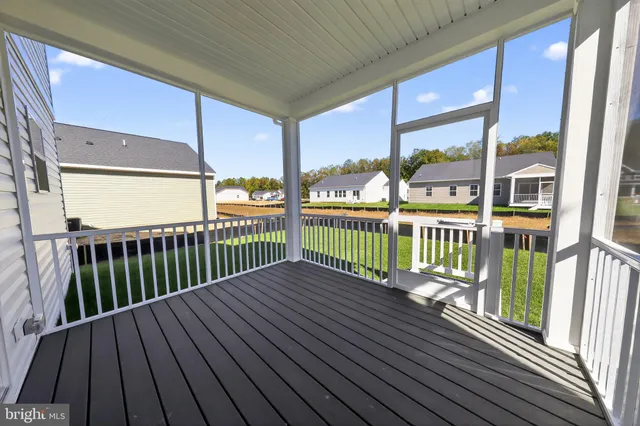 a view of a balcony with wooden floor