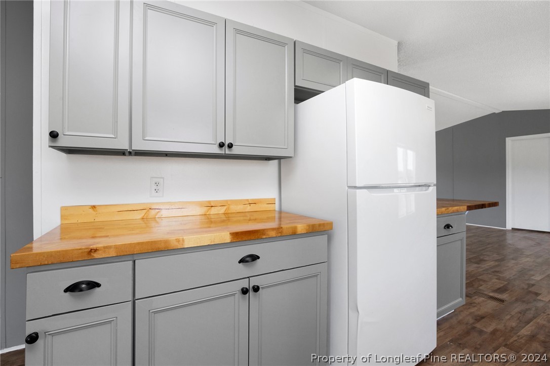 152 Three Bridges Road Rowland, NC 28383 - Photo 9 of 27 a kitchen with refrigerator and cabinets