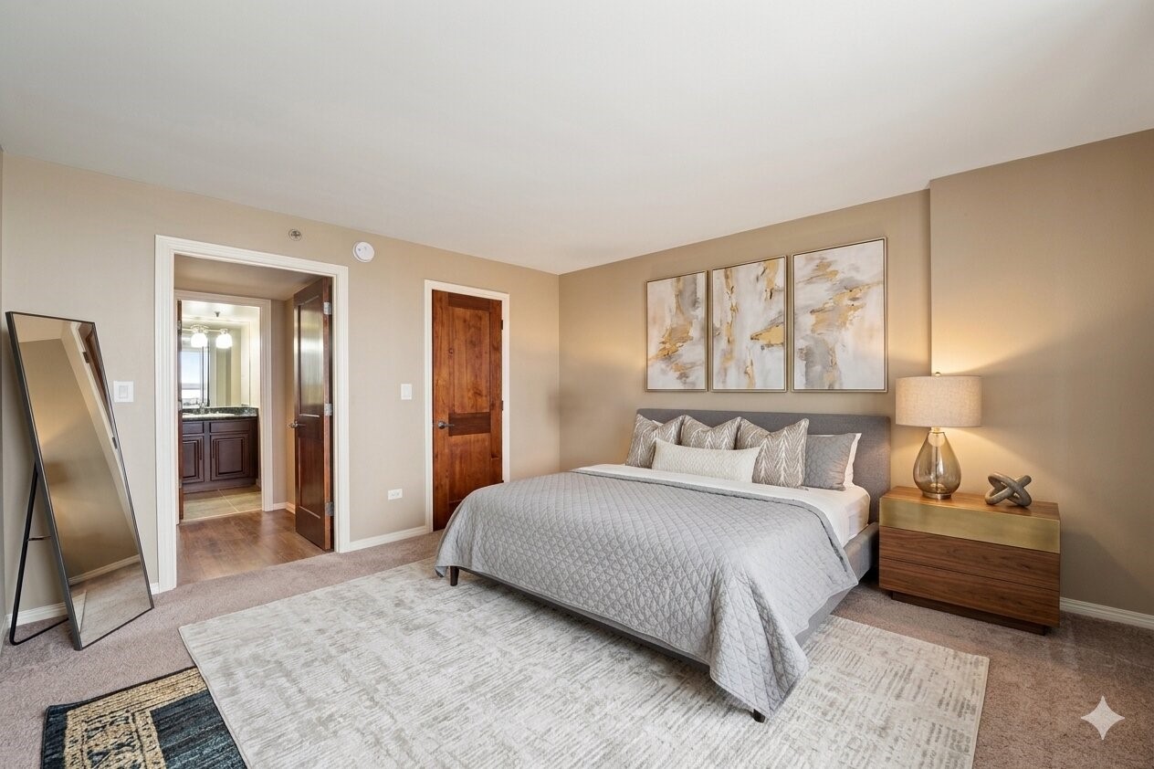 3525 Sage Road, Unit 1111 Houston, TX 77056 - Photo 8 of 10 a bedroom with a bed wooden floor and window