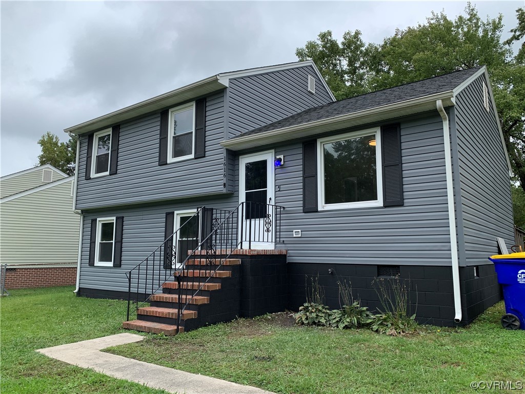 1616 Westbrook Road Hopewell, VA 23860 - Photo 1 of 24 a front view of a house with a garden