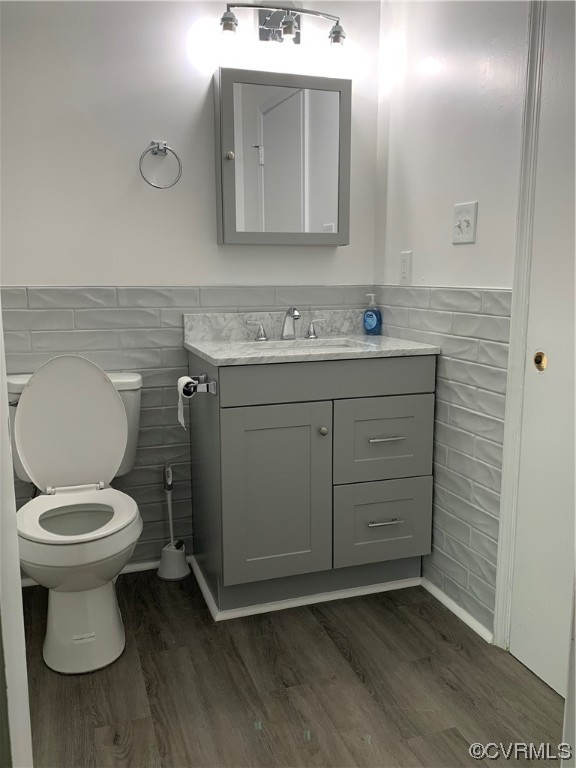 1616 Westbrook Road Hopewell, VA 23860 - Photo 16 of 24 a bathroom with a toilet sink and mirror