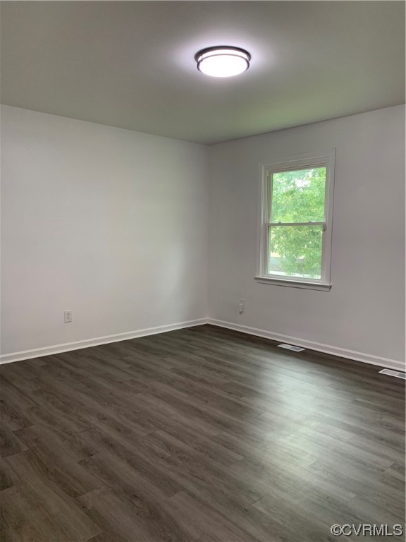 1616 Westbrook Road Hopewell, VA 23860 - Photo 18 of 24 an empty room with wooden floor and windows