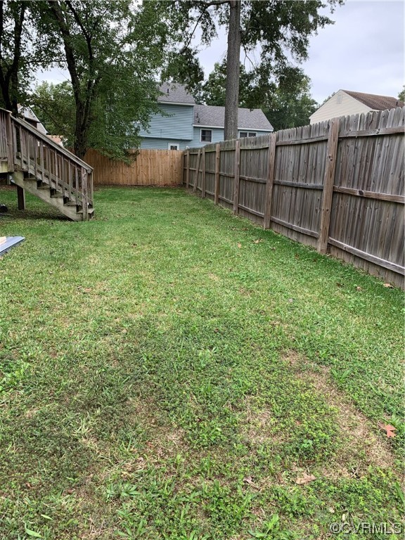 1616 Westbrook Road Hopewell, VA 23860 - Photo 22 of 24 a view of a yard with wooden fence and trees
