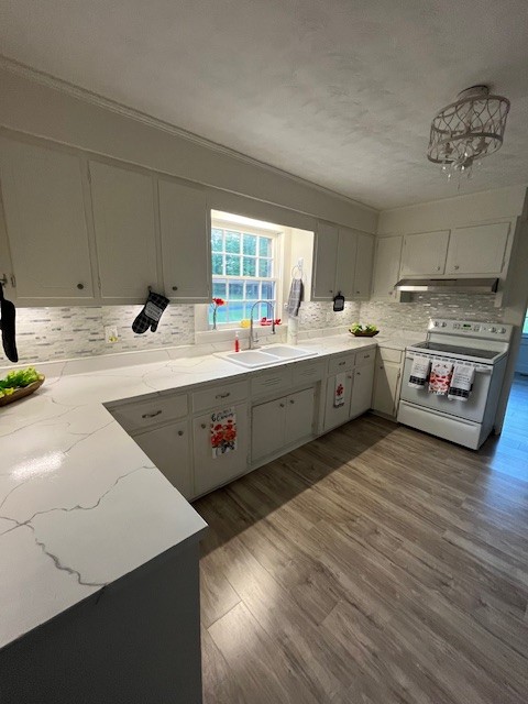 1386 Chisholm Road Cypress Inn, TN 38452 - Photo 23 of 58 a large white kitchen with a large window