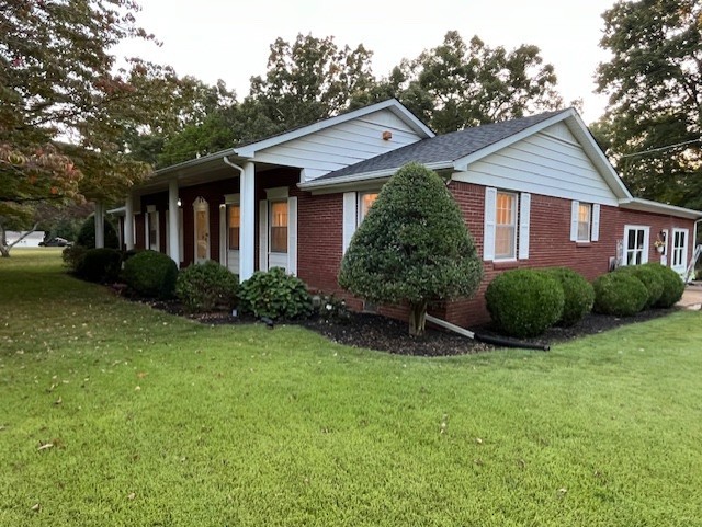1386 Chisholm Road Cypress Inn, TN 38452 - Photo 6 of 58 a view of a house with backyard and garden