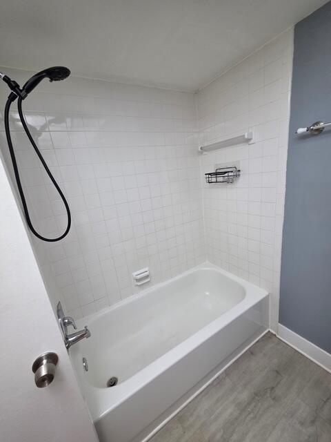 9440 Southwest 8th Street, Unit 417 Boca Raton, FL 33428 - Photo 15 of 21 a bathroom with a bath tub and a shower
