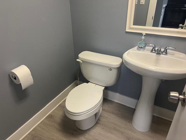 9440 Southwest 8th Street, Unit 417 Boca Raton, FL 33428 - Photo 16 of 21 a white toilet sitting next to a bathroom sink