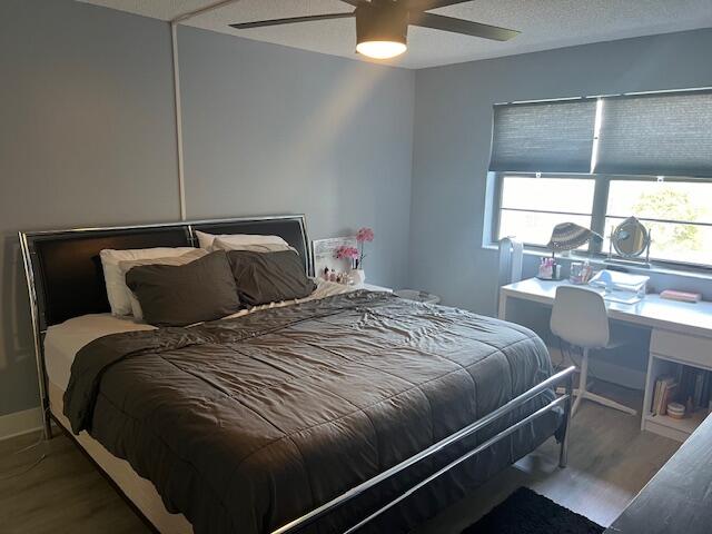 9440 Southwest 8th Street, Unit 417 Boca Raton, FL 33428 - Photo 9 of 21 a bedroom with a bed and a window