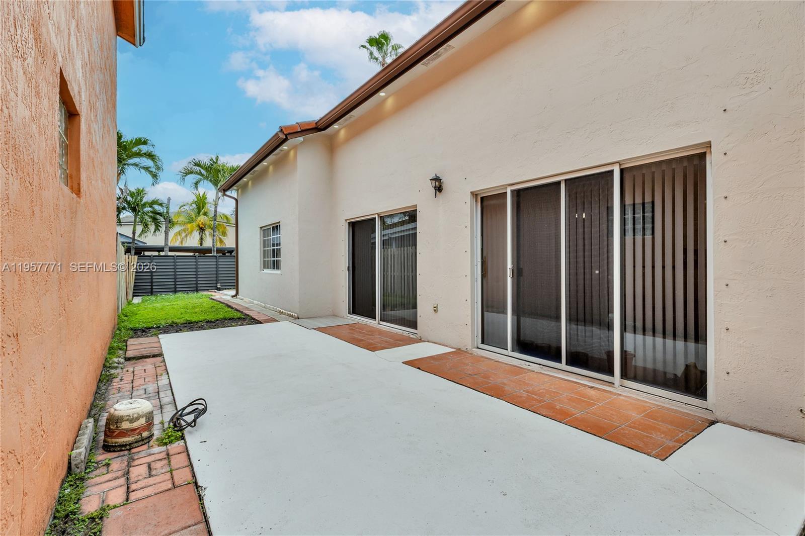 8211 Northwest 194th Terrace Hialeah, FL 33015 - Photo 20 of 25 Side Patio