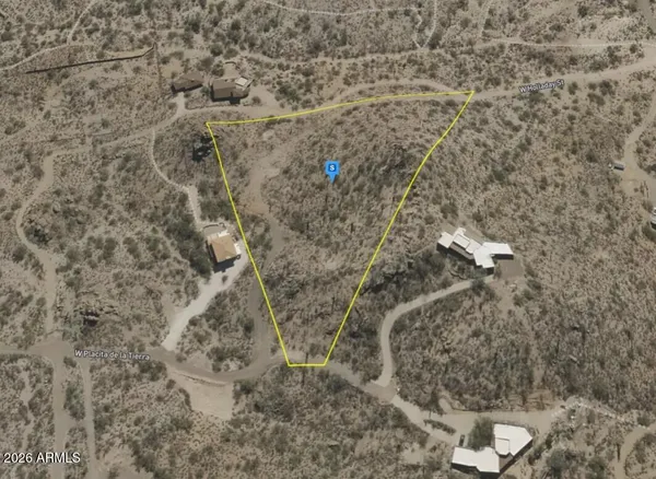 a aerial view of a house with a yard