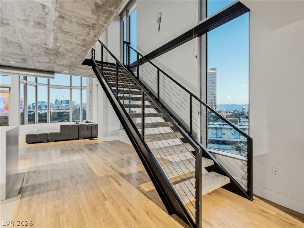 360 East Desert Inn Road, Unit 607 Las Vegas, NV 89109 - Photo 36 of 55 Floor-to-ceiling windows and an industrial-chic staircase define this vibrant urban loft.
