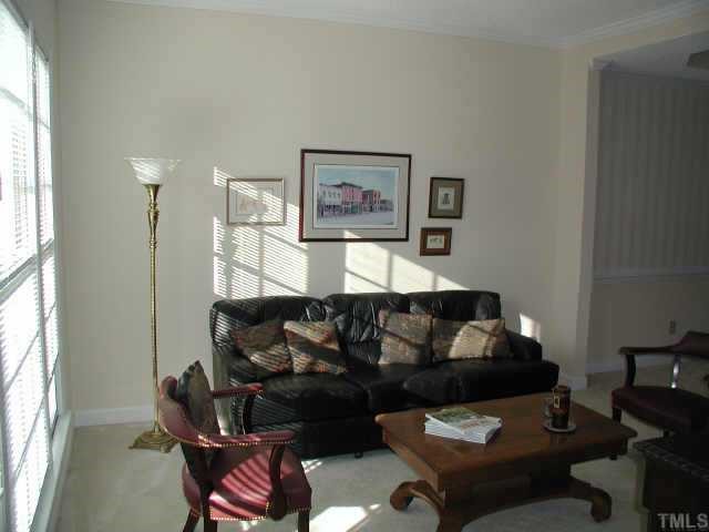 4432 Pike Road Raleigh, NC 27613 - Photo 2 of 10 a living room with furniture and a window