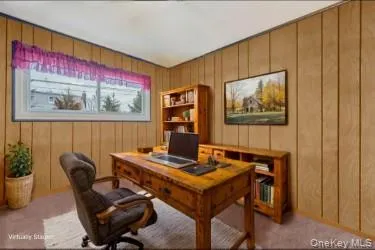 a view of a workspace with furniture