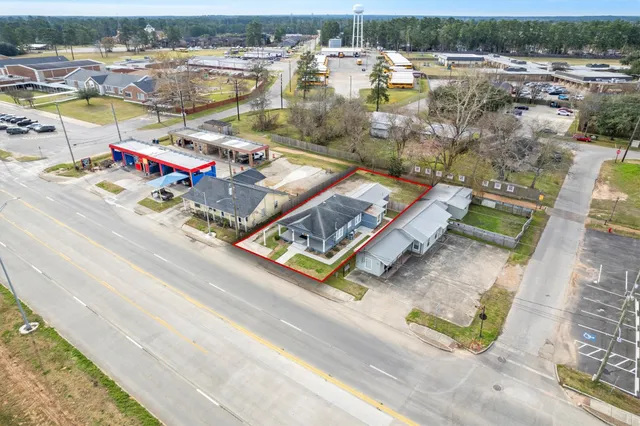 an aerial view of residential houses with outdoor space