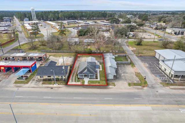 an aerial view of residential houses with outdoor space