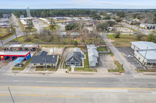 an aerial view of residential houses with outdoor space