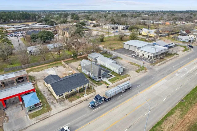 an aerial view of residential houses with outdoor space