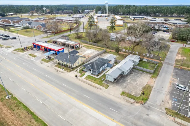 an aerial view of residential houses with outdoor space